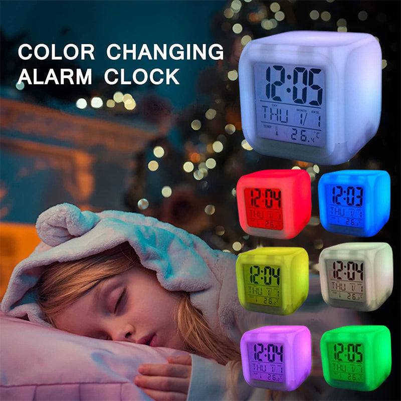 Colour-changing alarm clock by the bed