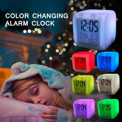 Colour-changing alarm clock by the bed