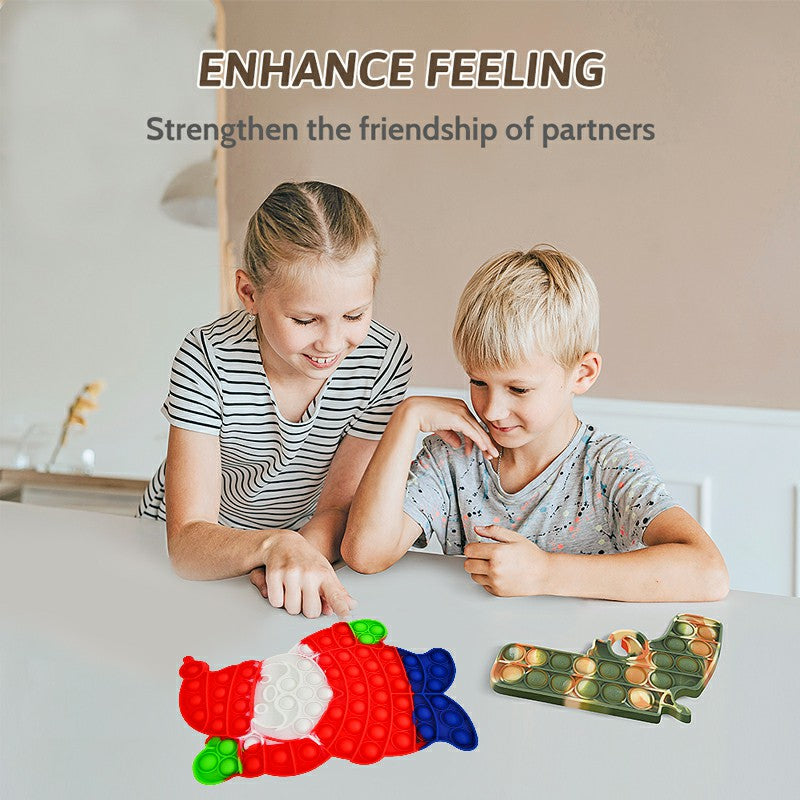 Two children playing with a push-pop fidget