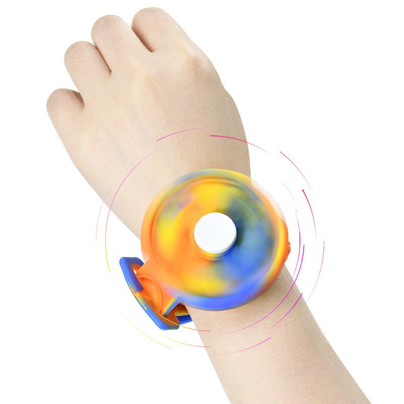 Spinning the dial on the fidget bracelet