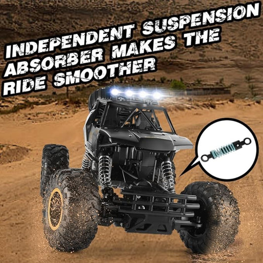 Black 1:12 RC rock crawler with LED headlights driving on sand